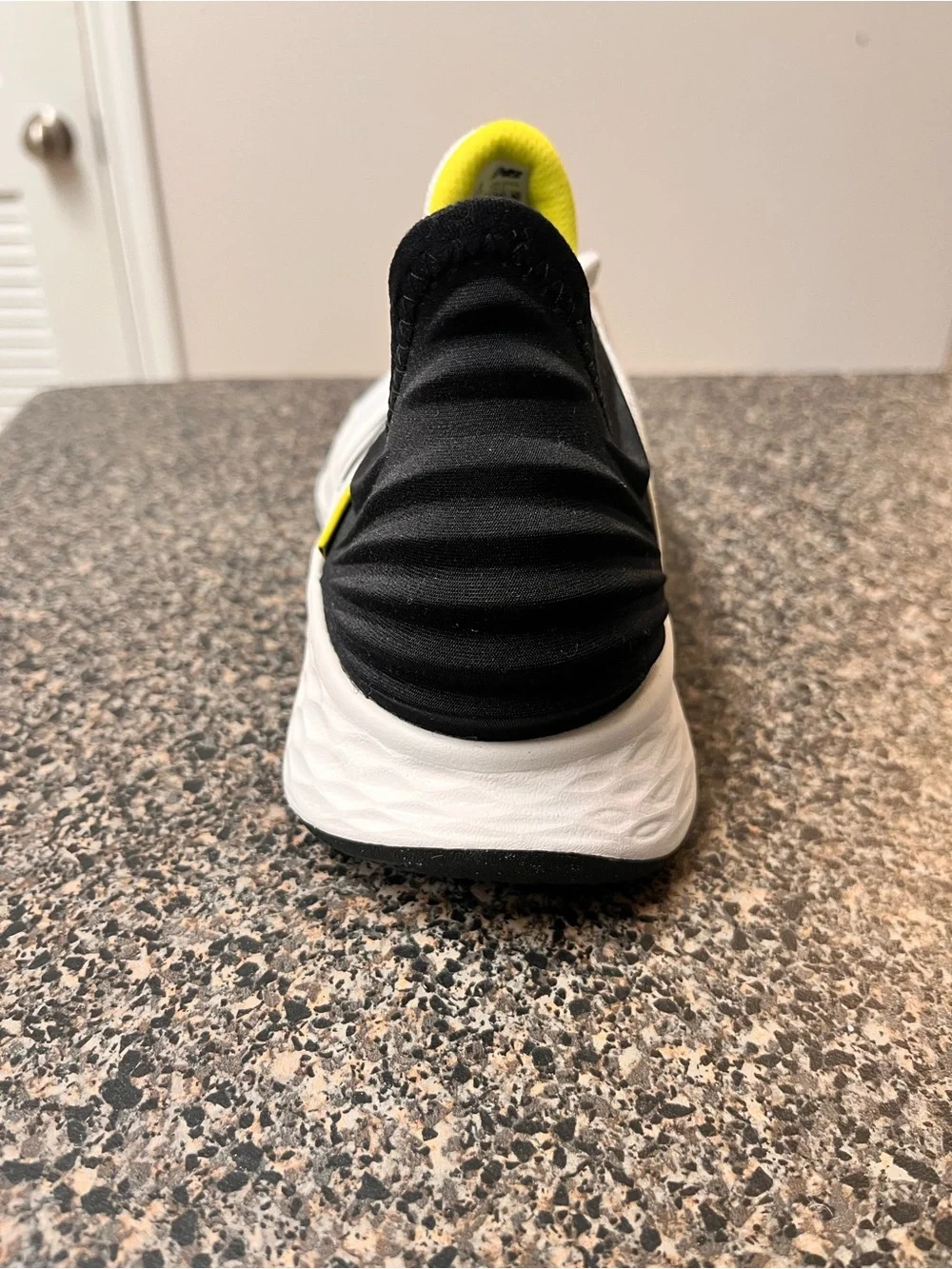 New Balance White Black Athletic Running Shoes with Yellow Accent